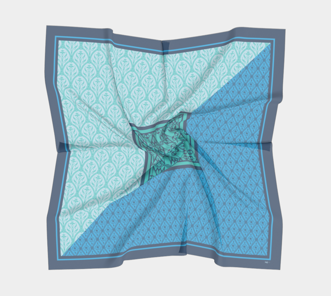 This silk scarf features a mix of contrasting patterns in beautiful shades of blue.