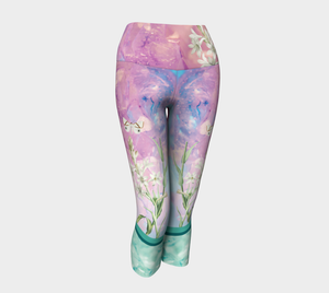 A unique blend of crystal imagery and butterfly florals adorns these capri length  leggings