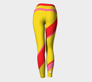 Compression leggings featuring our signature color palette of bold yellow, pink and red, adorned with "Sweat Goddess" along one leg.