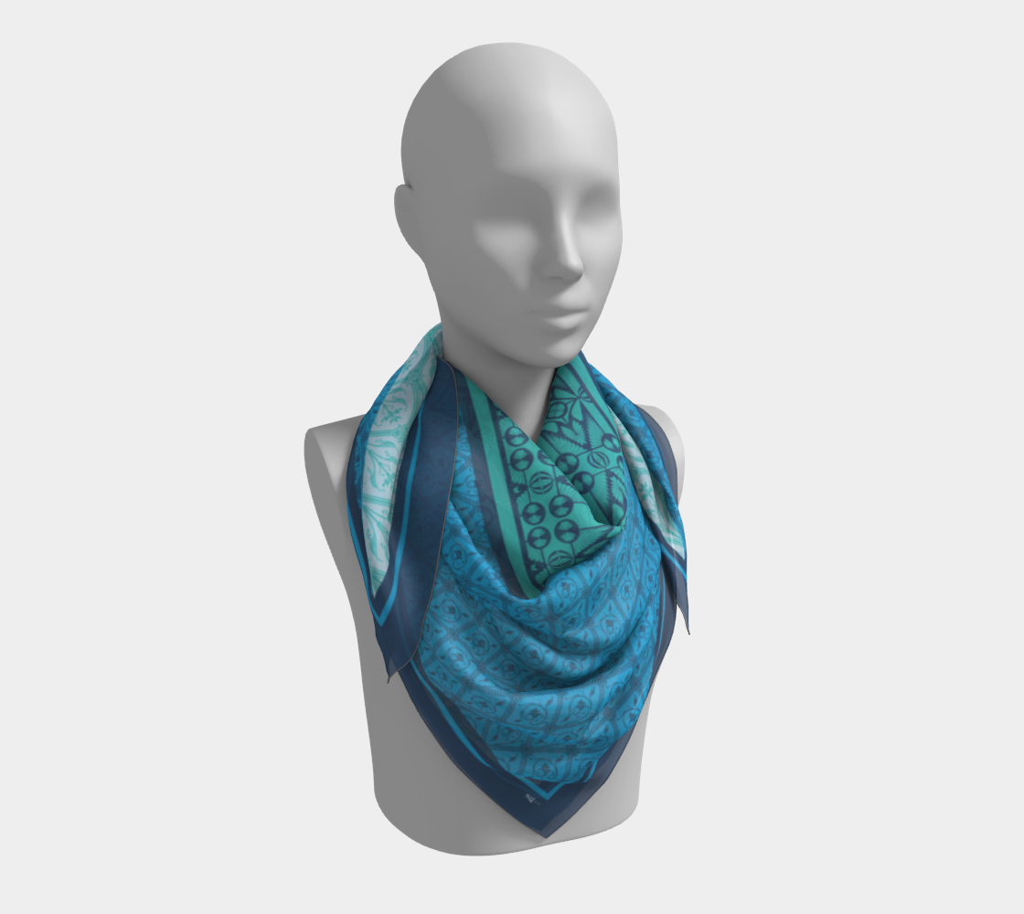 This silk scarf features a mix of contrasting patterns in beautiful shades of blue.