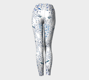 Compression leggings adorned with tiny blue florals and hummingbirds.