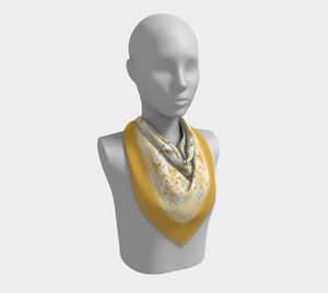 Florals and vintage yellow ornaments adorn this 100% silk charmeuse scarf.