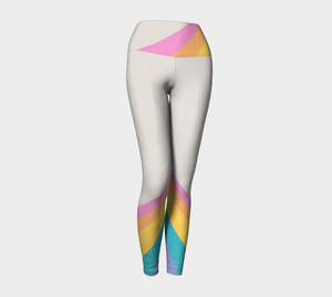 A color block style featuring a colorful rainbow adorn these compression leggings