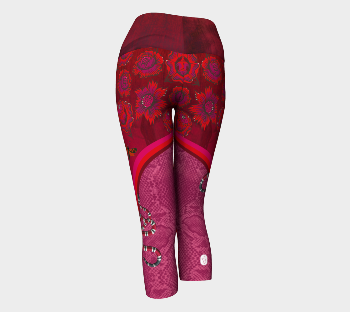 Billows of red clouds set amidst pink snakeskin, dusted with snakes and red butterflies on these capri length leggings