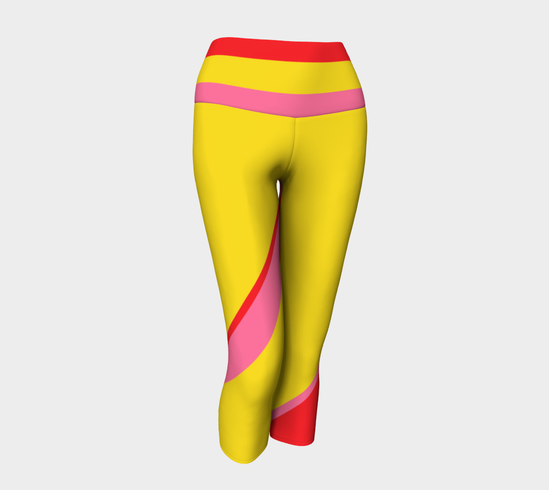 Capri length leggings featuring our signature color palette of bold yellow, pink and red, adorned with "Sweat Goddess" along one leg.