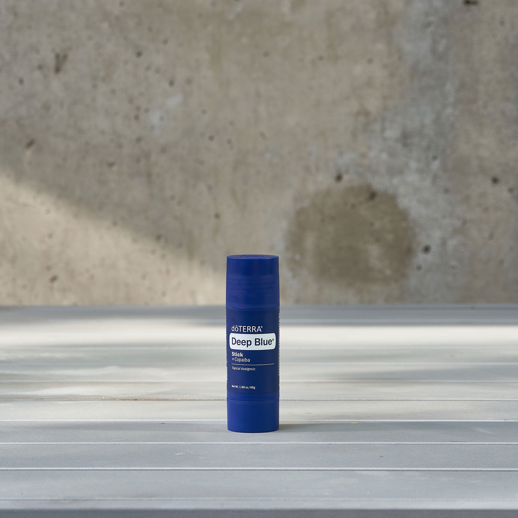 Deep blue stick infused with copaiba essential oils to soothe sore muscles.