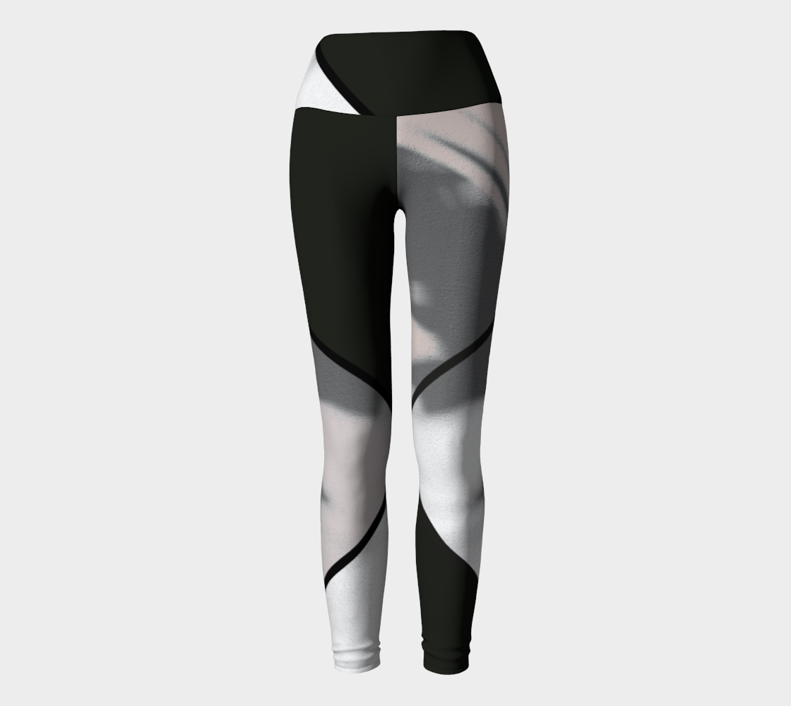 A bold black and white color blocking print adorn these high-waisted compression leggings