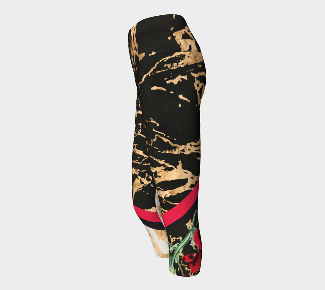 Red botanicals splash onto a gold splattered background on these capri length leggings