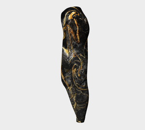 Black and Gold ethereal patterns evoke moon dust on these compression leggings.