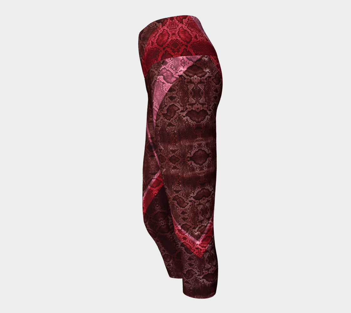 High waisted compression capris Featuring snakeskin color blocking in a red and pink color palette.